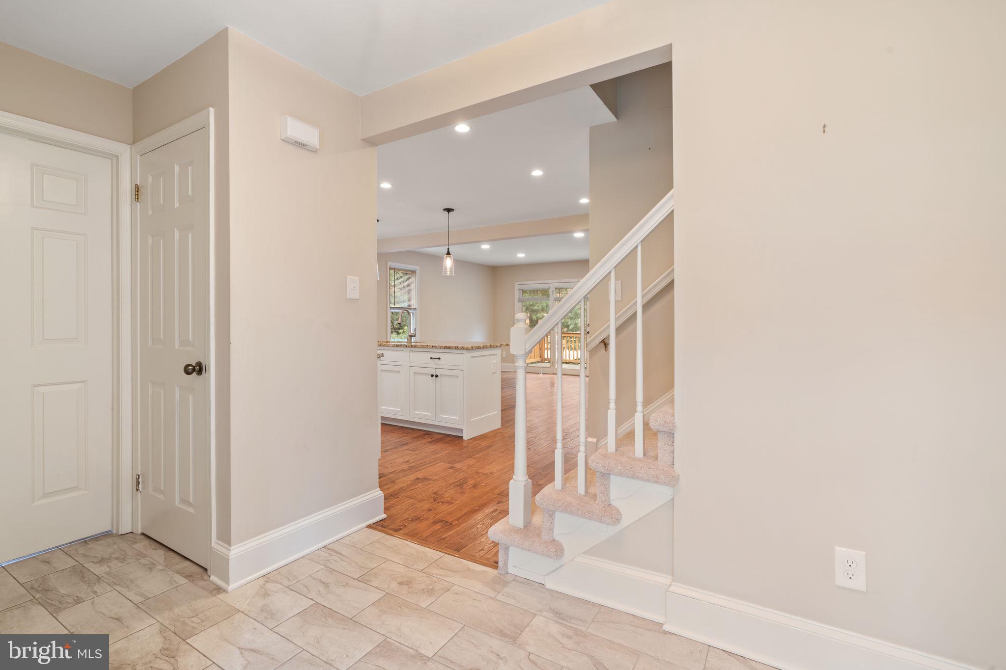 115 Roumfort Road, Unit 26 Philadelphia, PA 19119 - Photo 4 of 33 a view of a hallway with closet and a large window