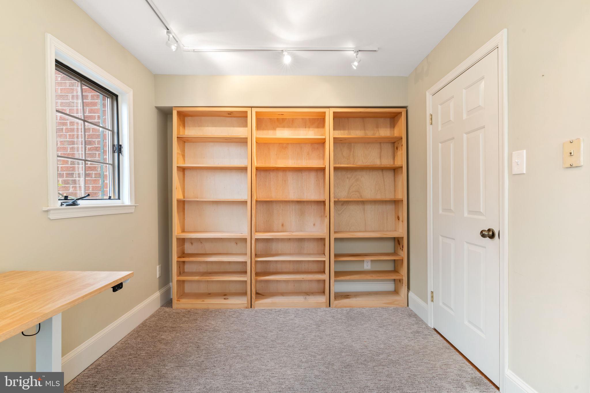 115 Roumfort Road, Unit 26 Philadelphia, PA 19119 - Photo 7 of 33 a view of an empty room with a window