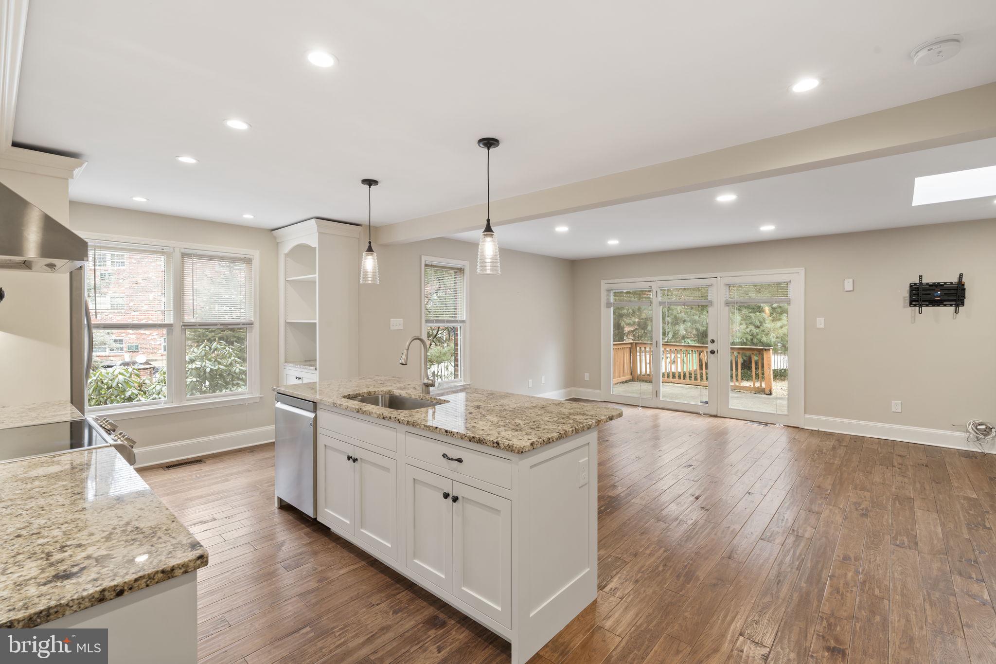 115 Roumfort Road, Unit 26 Philadelphia, PA 19119 - Photo 9 of 33 a large kitchen with granite countertop a large counter top and sink