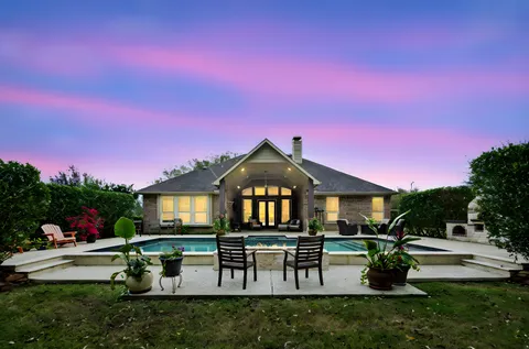 a view of a house with a big yard