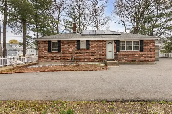 front view of a house with a yard