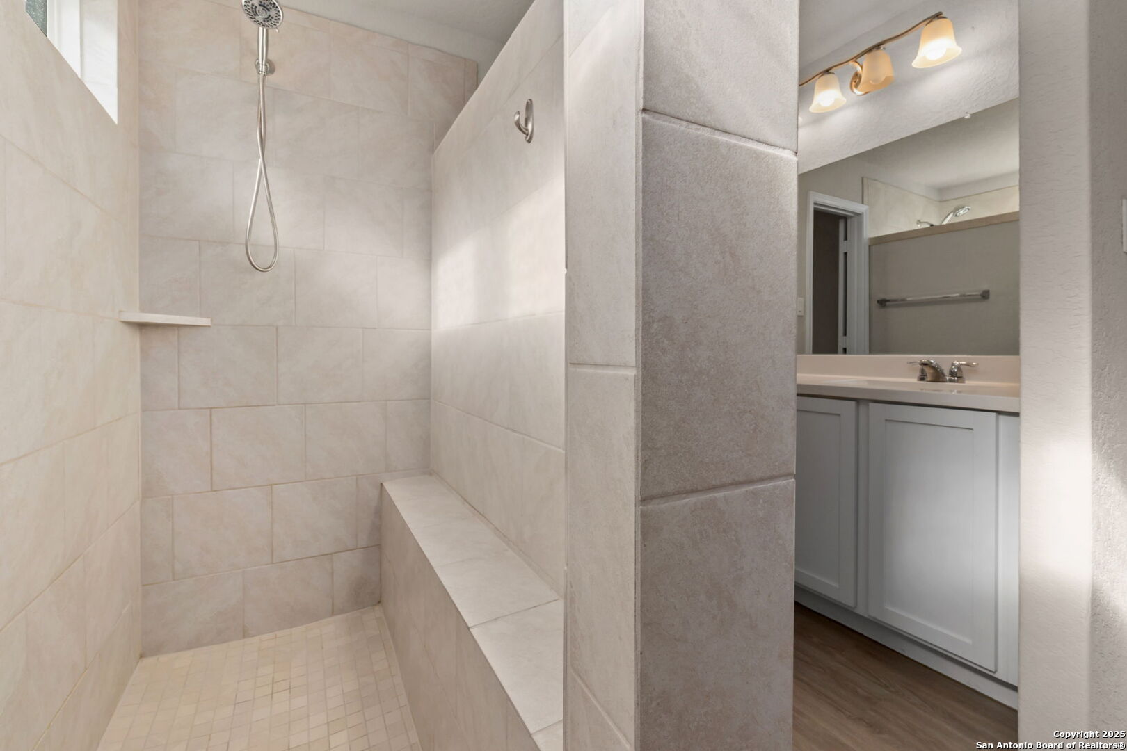 10306 Midsummer Meadow Converse, TX 78109 - Photo 17 of 20 a bathroom with a bathtub and a shower
