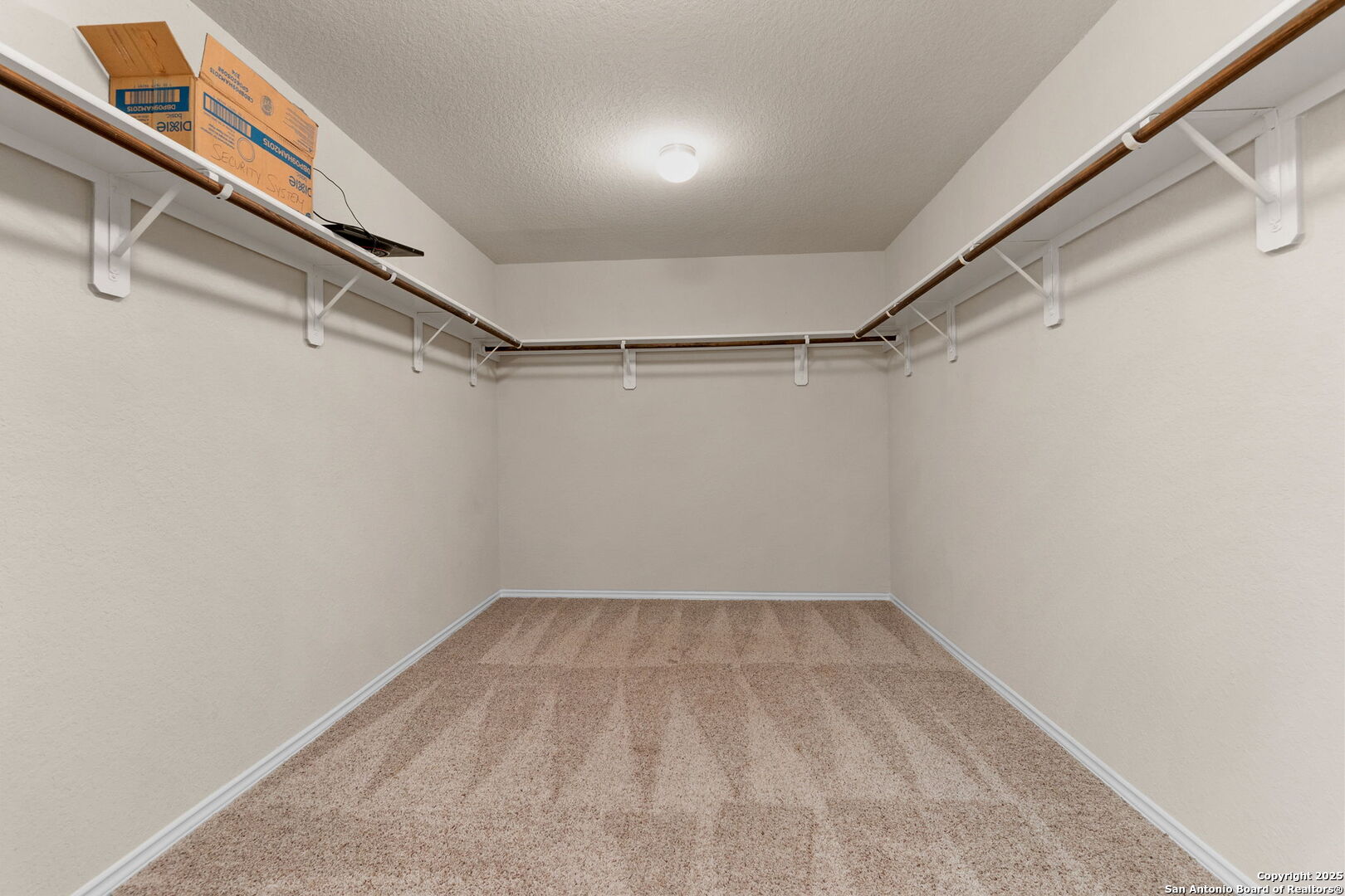 10306 Midsummer Meadow Converse, TX 78109 - Photo 18 of 20 a view of a room with racks on the wall