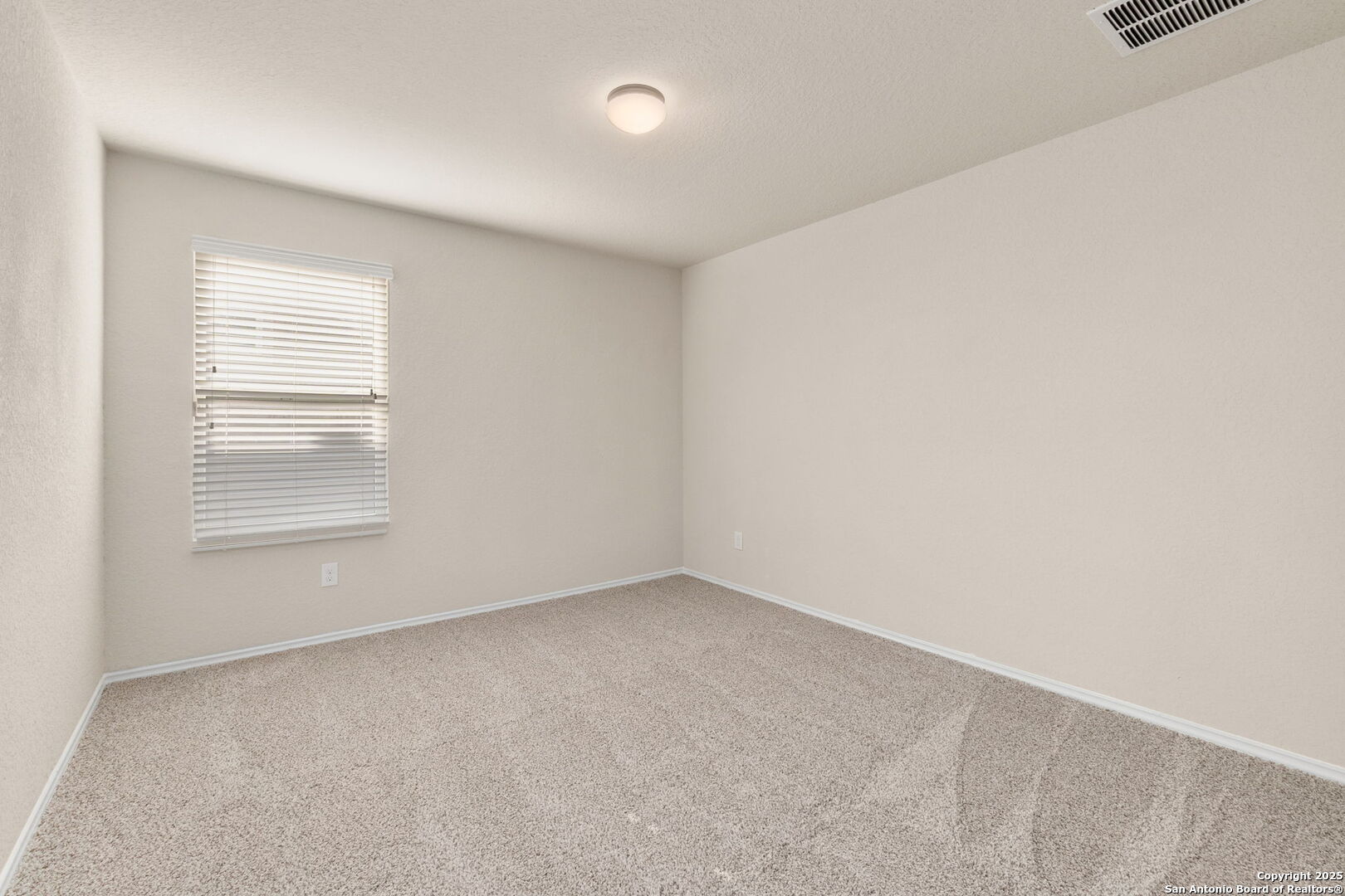 10306 Midsummer Meadow Converse, TX 78109 - Photo 4 of 20 an empty room with a window