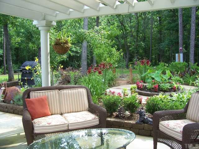 640 Lanes Mill Road Bennett, NC 27208 - Photo 11 of 12 a view of a patio with furniture and garden