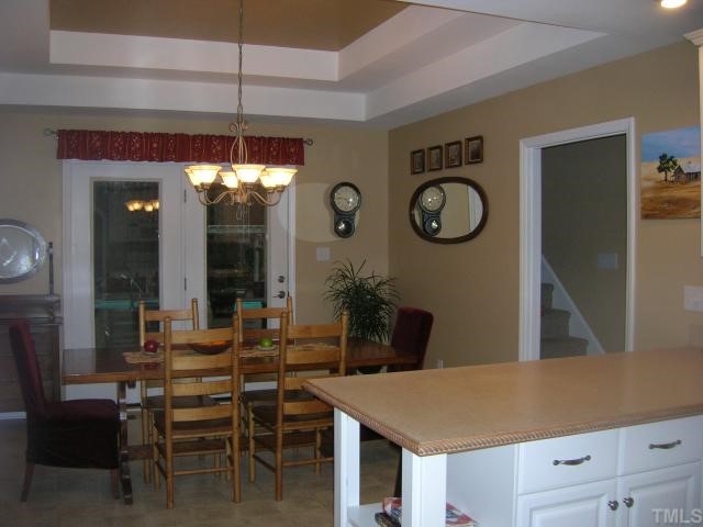 640 Lanes Mill Road Bennett, NC 27208 - Photo 3 of 12 a open kitchen with a table and chairs