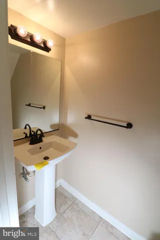 a bathroom with a sink and mirror