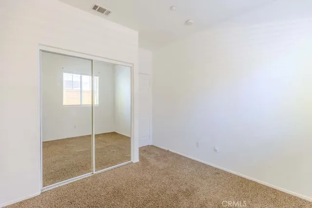 a bathroom with a sink mirror and a shower