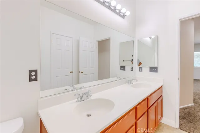 a bathroom with a granite countertop sink
