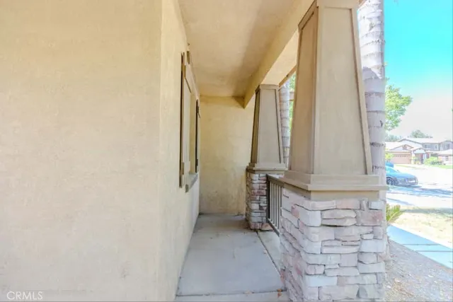a large kitchen with a stove a sink a refrigerator and blue cabinets