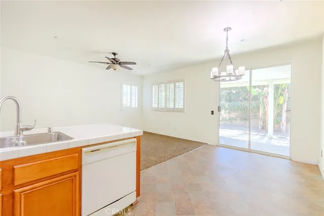 a view of a room with a sink cabinets and a window