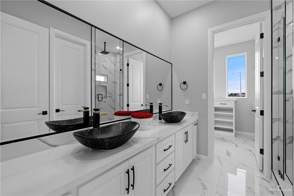 5100 Duke Avenue McAllen, TX 78504 - Photo 12 of 24 a bathroom with double sink and a mirror