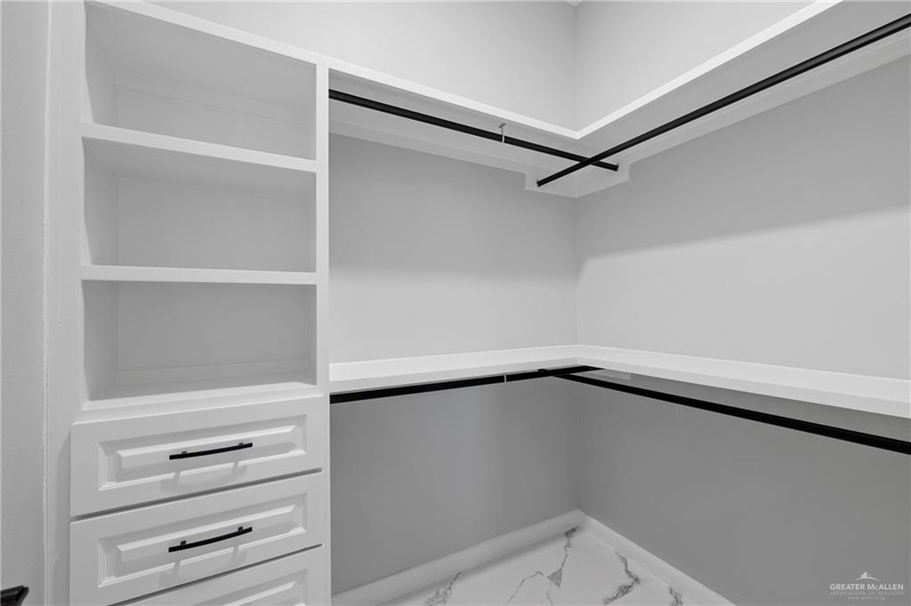 5100 Duke Avenue McAllen, TX 78504 - Photo 16 of 24 a view of walk in closet with empty racks