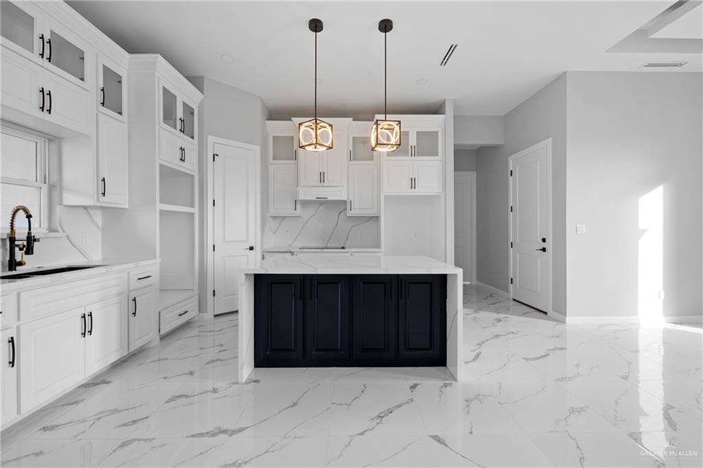 5100 Duke Avenue McAllen, TX 78504 - Photo 7 of 24 a large kitchen with cabinets