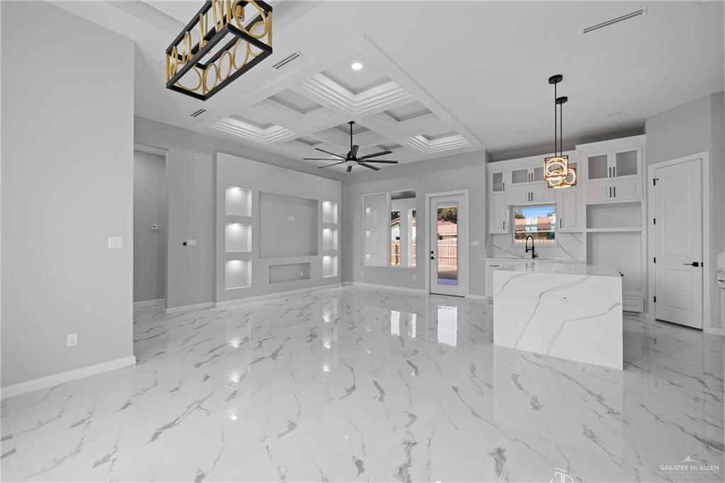 5100 Duke Avenue McAllen, TX 78504 - Photo 9 of 24 a view of a hallway with chandelier