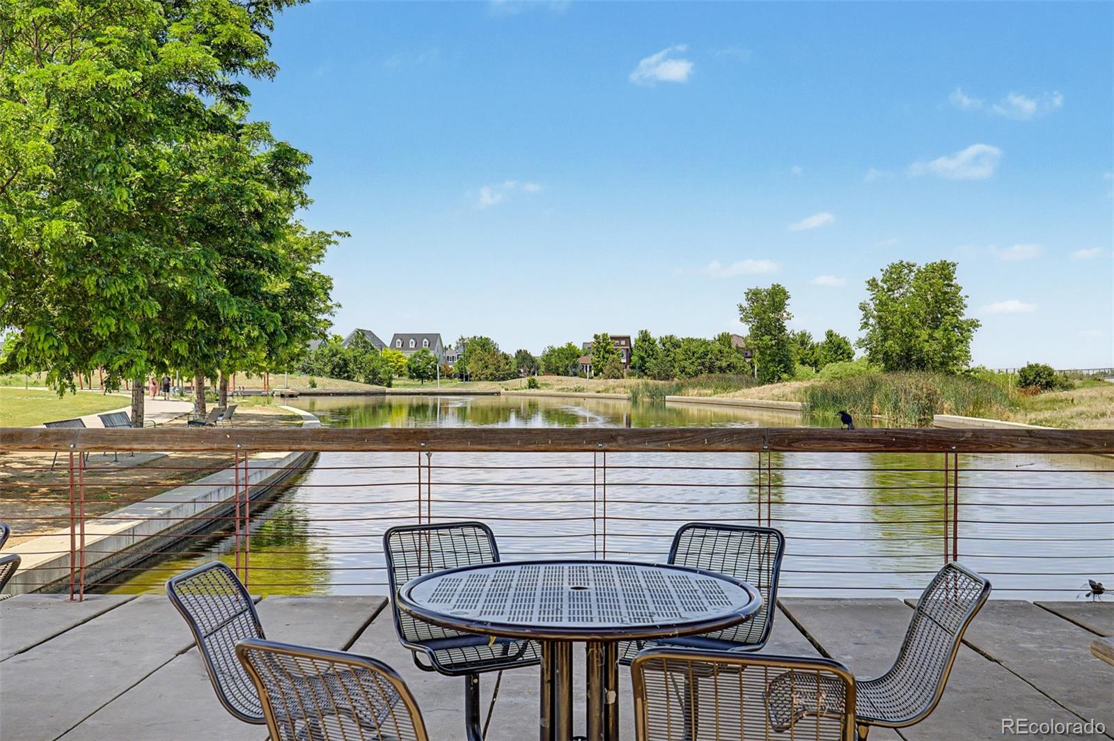 2908 Ironton Street Denver, CO 80238 - Photo 30 of 30 a view of a lake with couches and wooden floor
