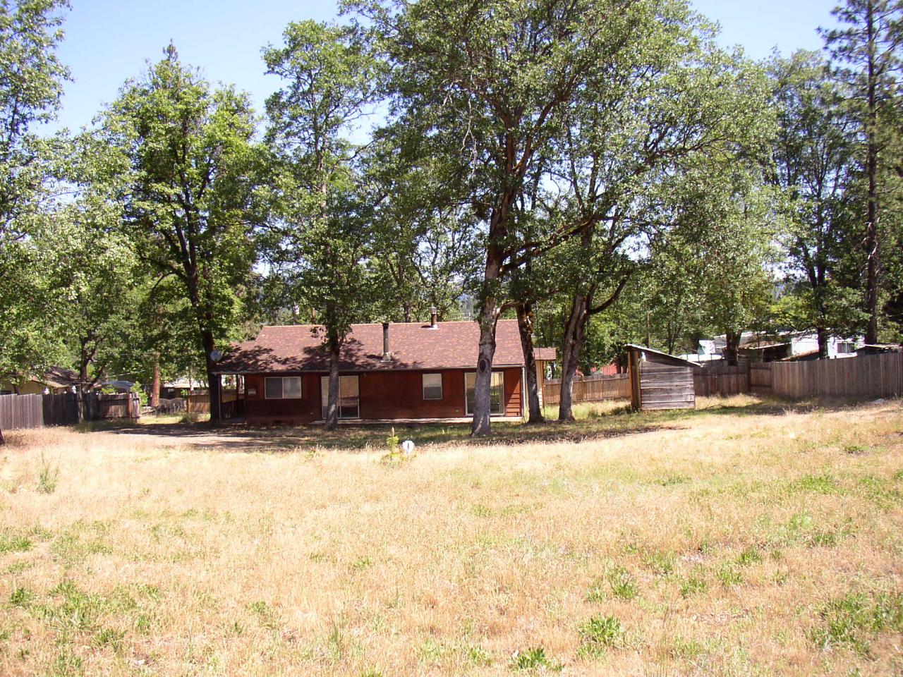 1450 Morgan Hill Road Hayfork, CA 96041 - Photo 3 of 13 a house with trees in front of it