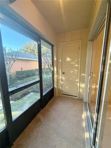 a view of a glass door and deck