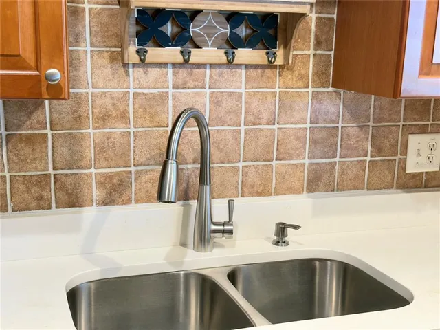 a kitchen with a sink and a window