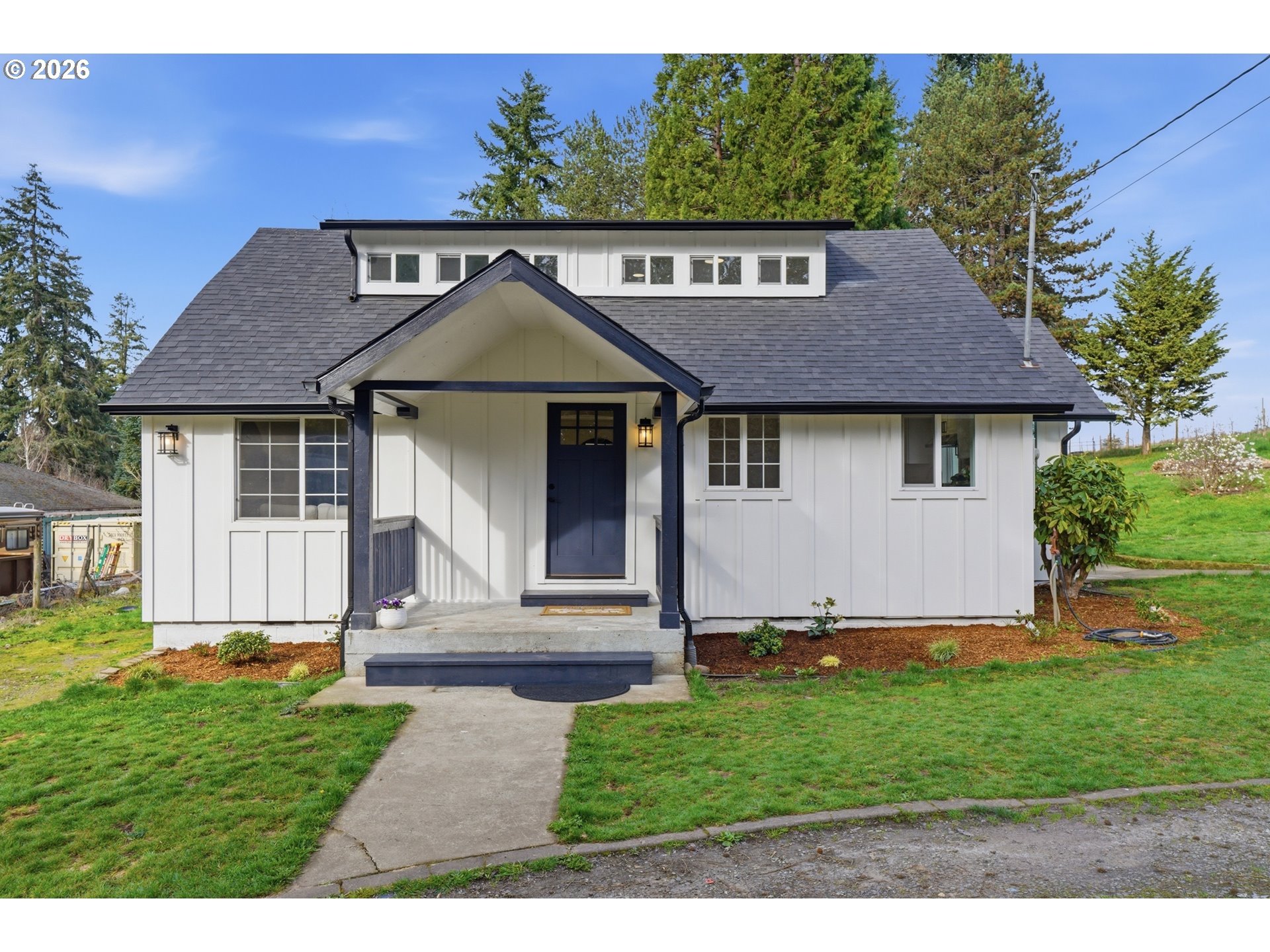 a front view of a house with a yard