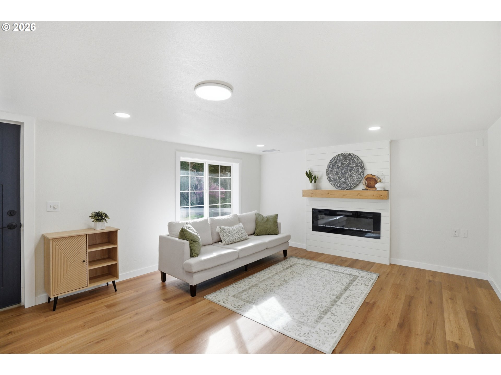 8207 Southeast Cottrell Road Gresham, OR 97080 - Photo 11 of 42 a living room with furniture and a wooden floor