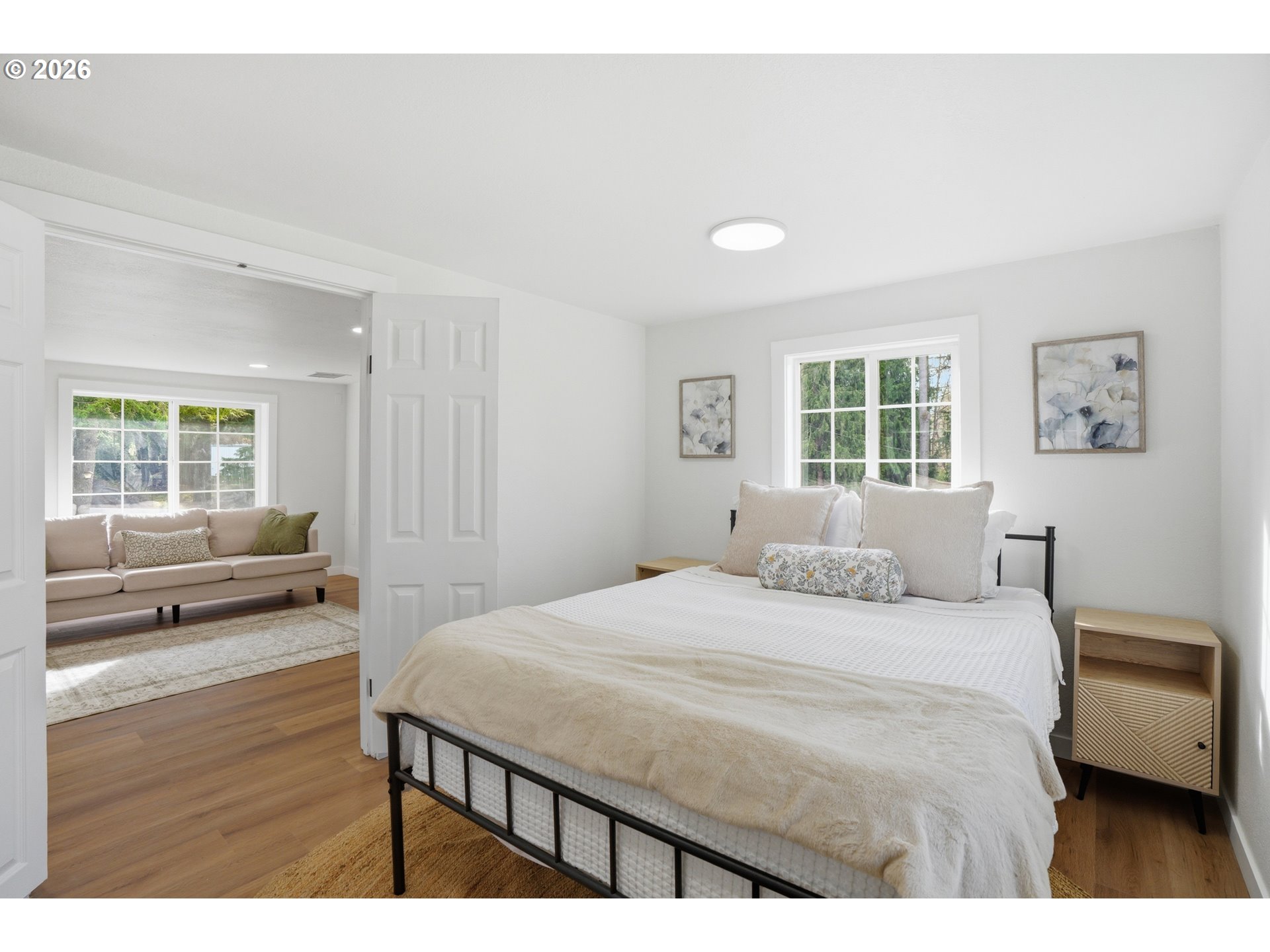 8207 Southeast Cottrell Road Gresham, OR 97080 - Photo 12 of 42 a bedroom with a bed and wooden floor