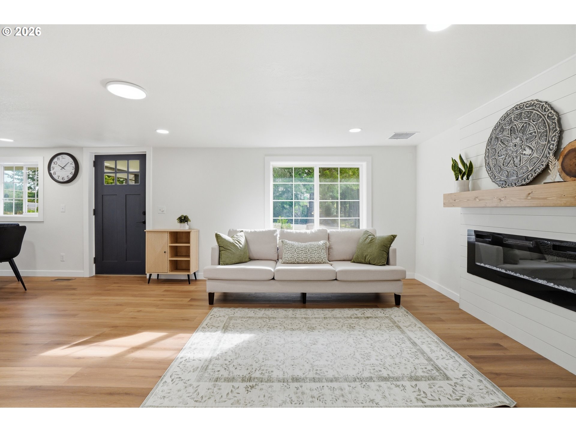 8207 Southeast Cottrell Road Gresham, OR 97080 - Photo 14 of 42 a living room with furniture and a fireplace