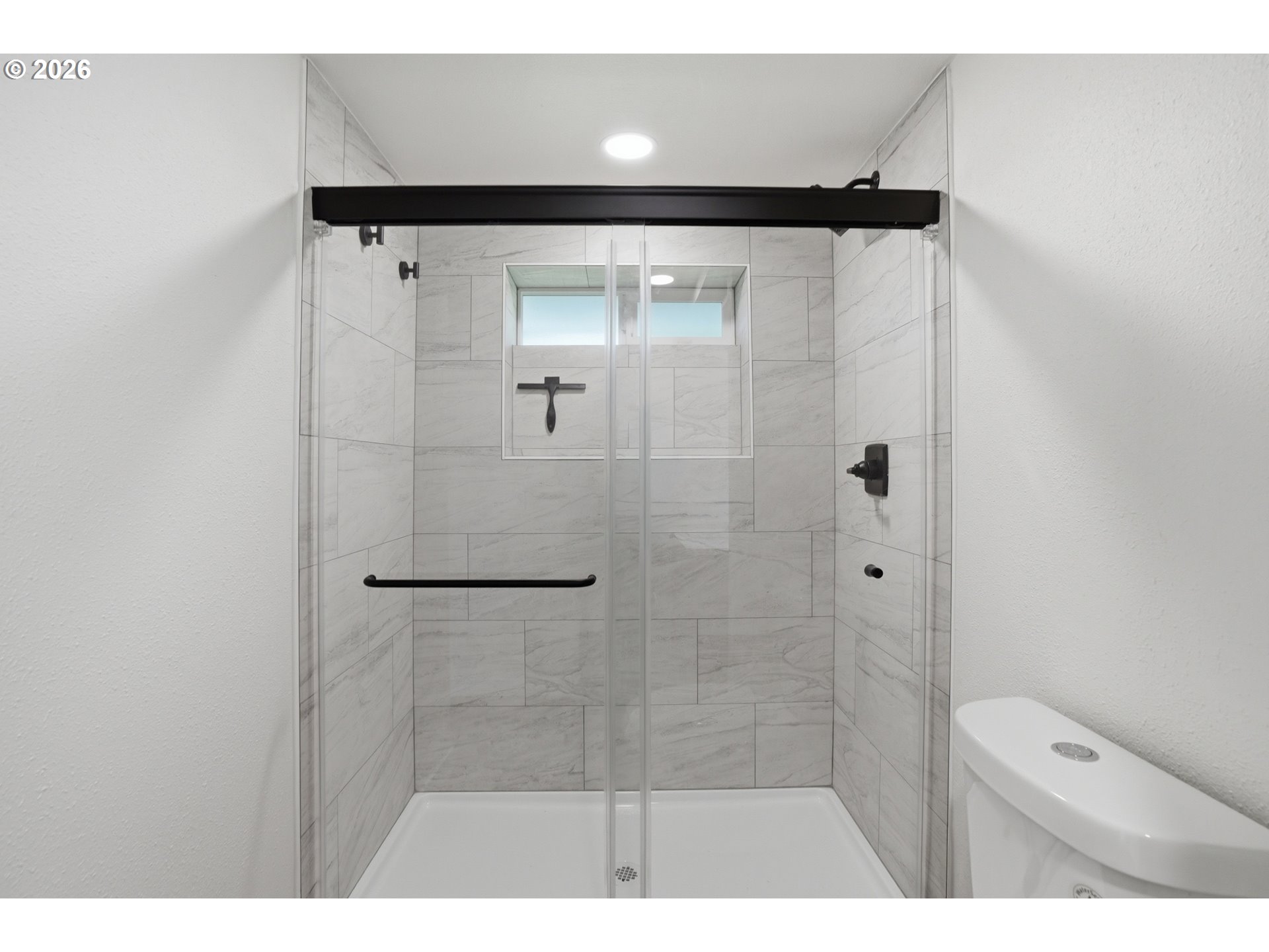 8207 Southeast Cottrell Road Gresham, OR 97080 - Photo 16 of 42 a bathroom with a shower and a toilet