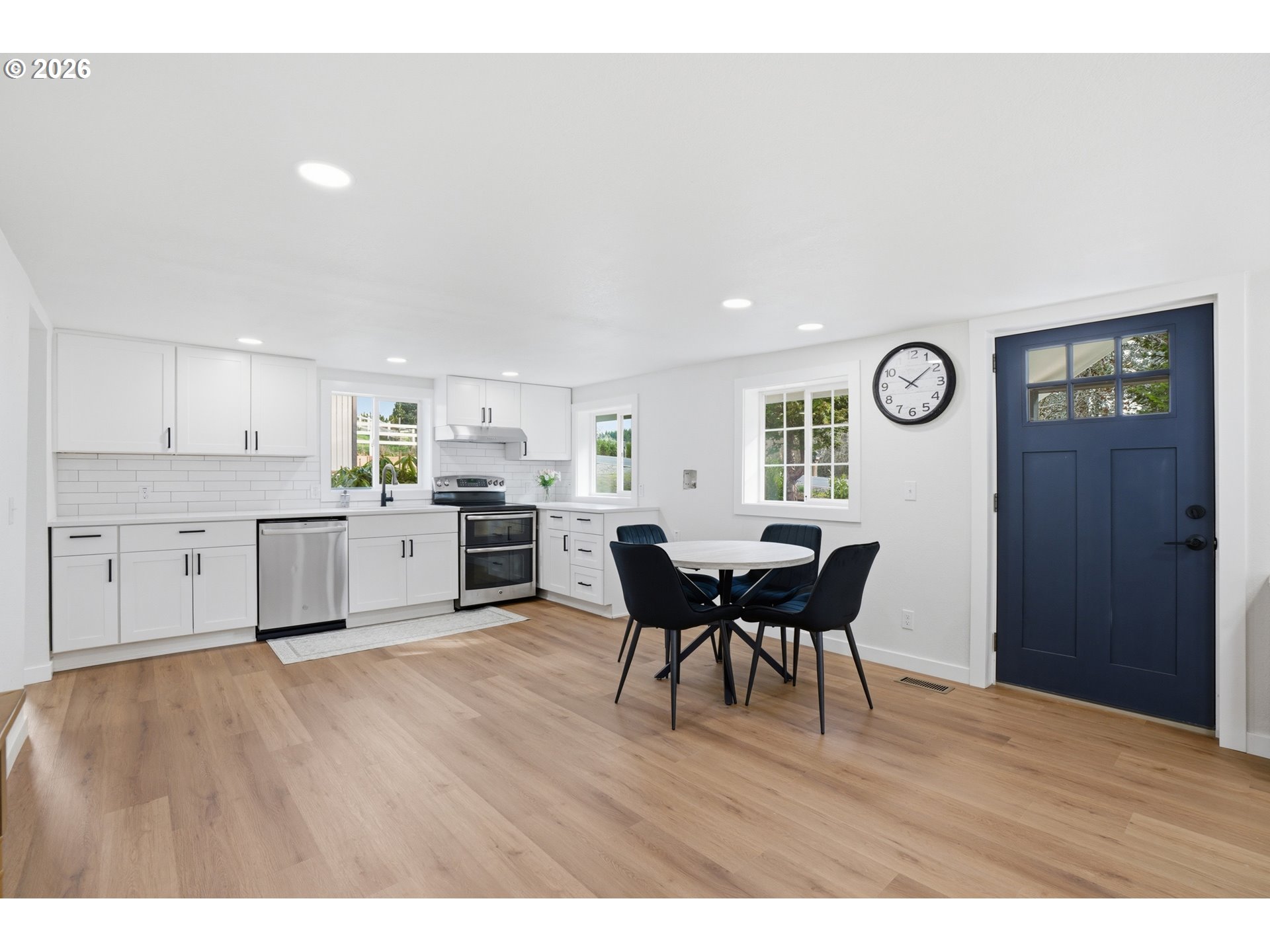 8207 Southeast Cottrell Road Gresham, OR 97080 - Photo 19 of 42 a open kitchen with cabinets table and chairs