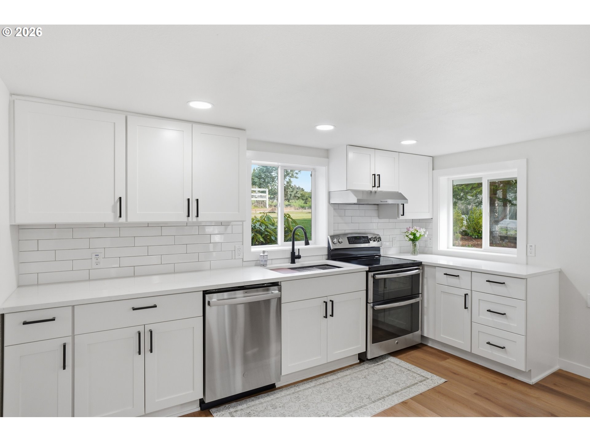 8207 Southeast Cottrell Road Gresham, OR 97080 - Photo 20 of 42 a kitchen with a sink stove and cabinets
