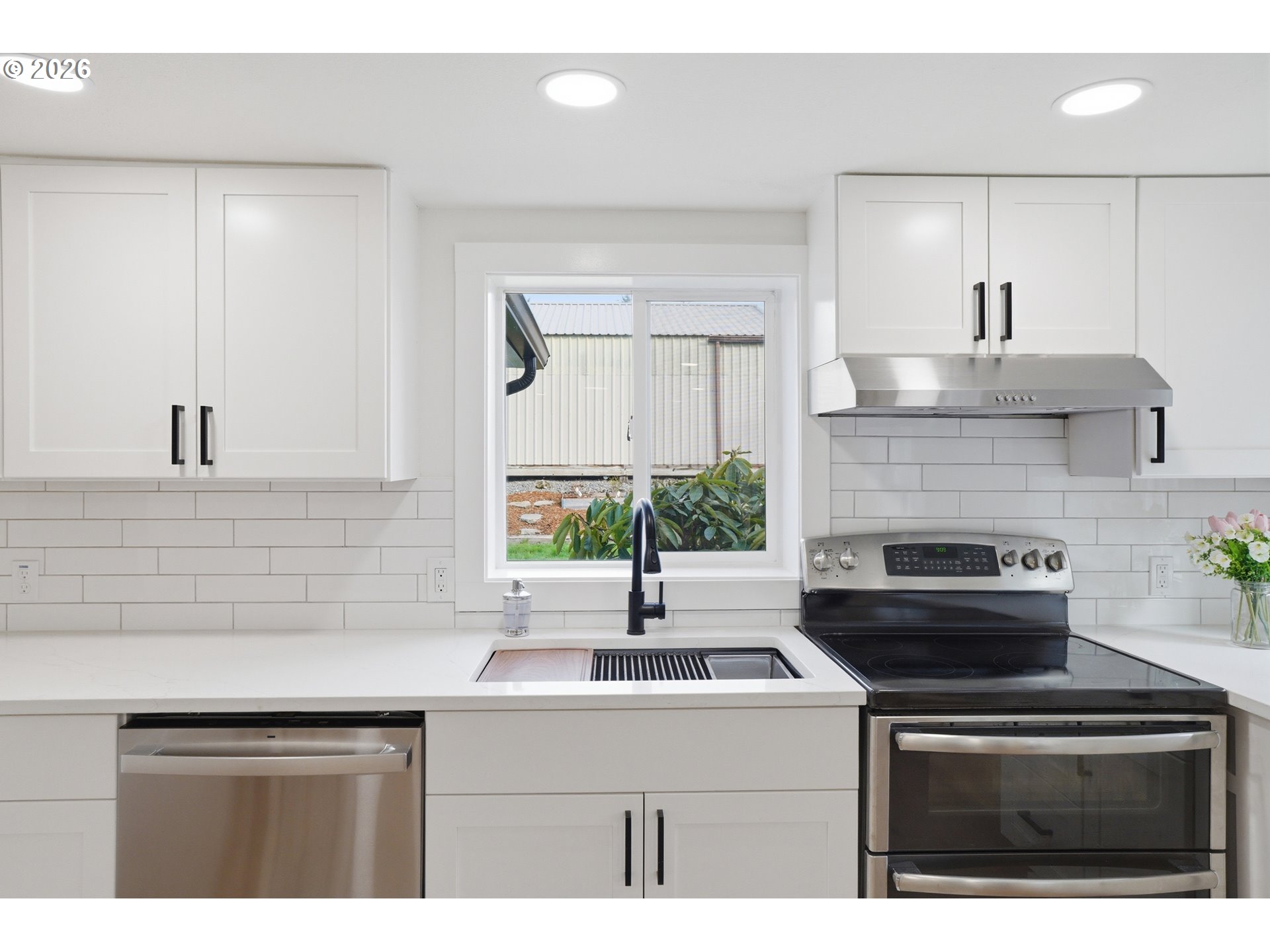 8207 Southeast Cottrell Road Gresham, OR 97080 - Photo 22 of 42 a kitchen with stainless steel appliances a sink stove and cabinets