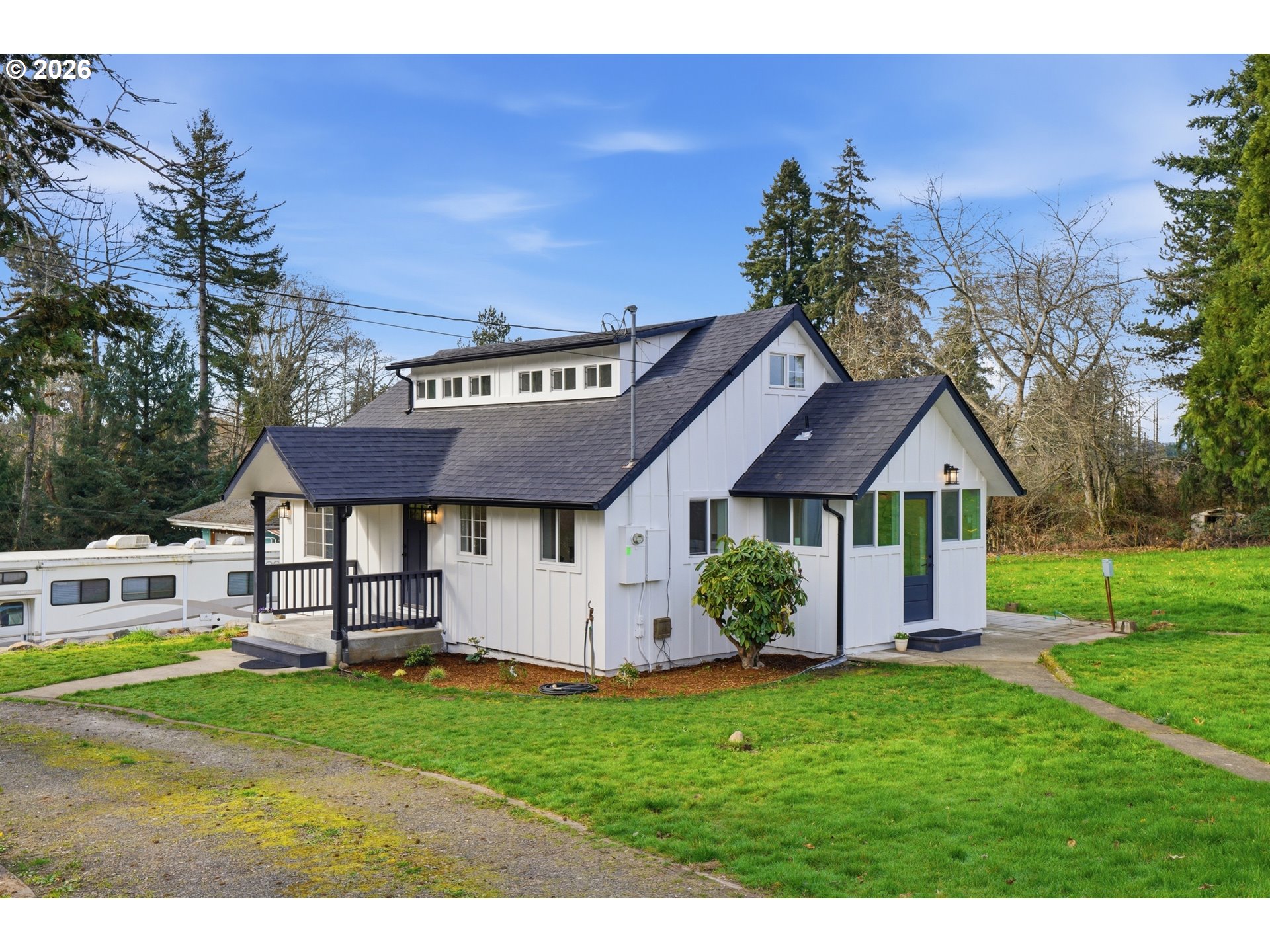 8207 Southeast Cottrell Road Gresham, OR 97080 - Photo 4 of 42 a view of a house with a big yard potted plants and large tree
