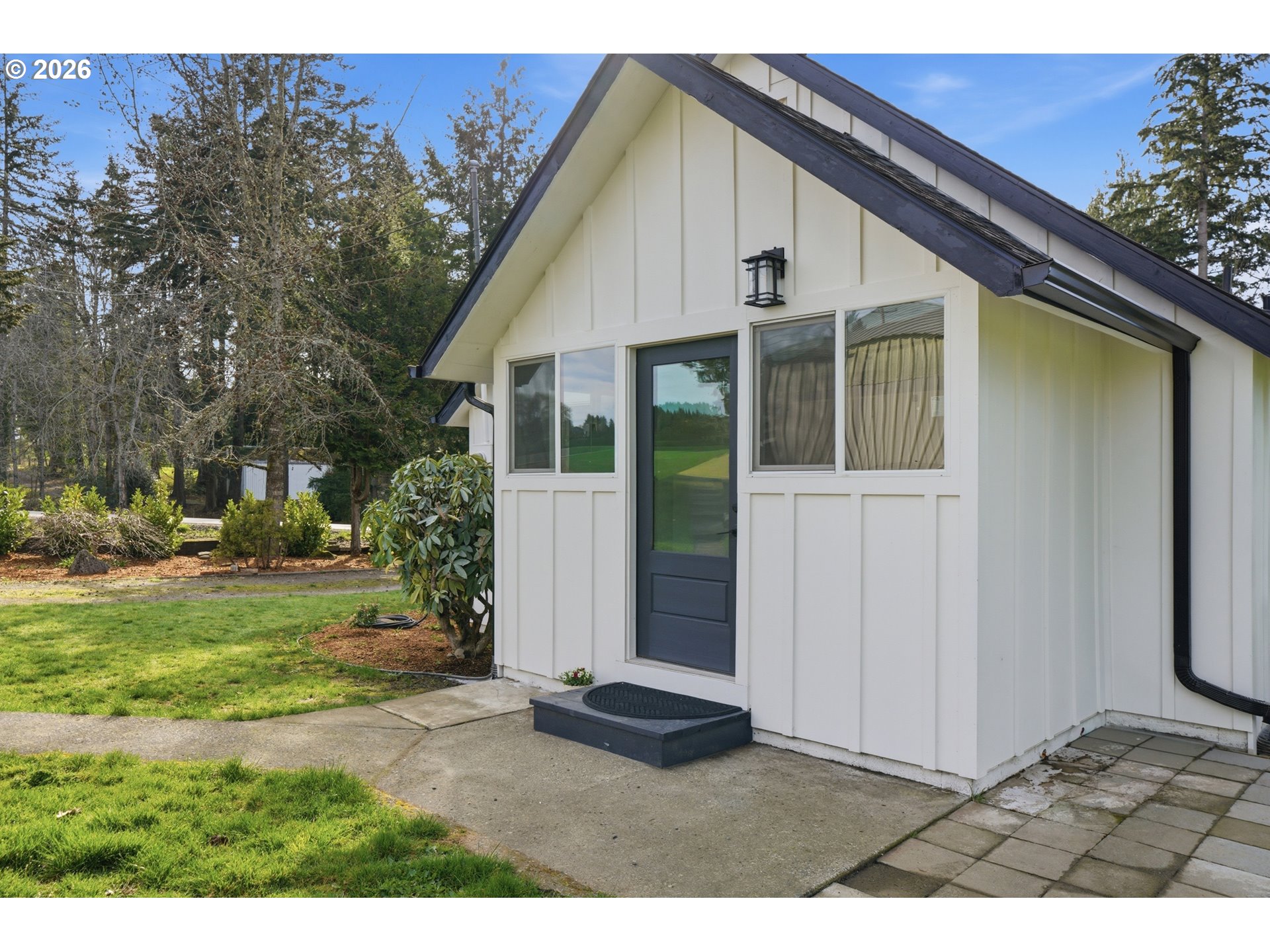 8207 Southeast Cottrell Road Gresham, OR 97080 - Photo 5 of 42 a view of a yard in front view of a house