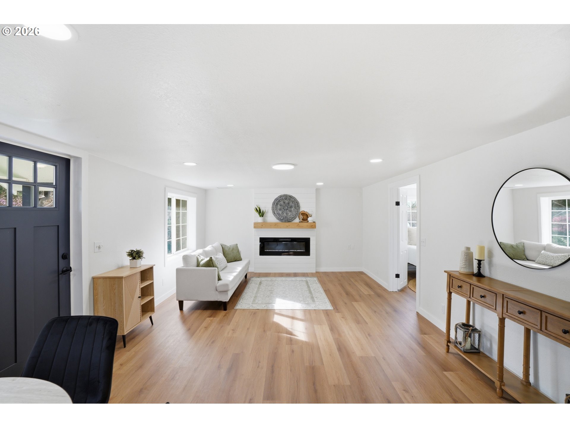 8207 Southeast Cottrell Road Gresham, OR 97080 - Photo 10 of 42 a living room with furniture and a wooden floor