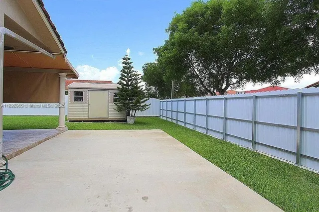 a view of backyard with green space