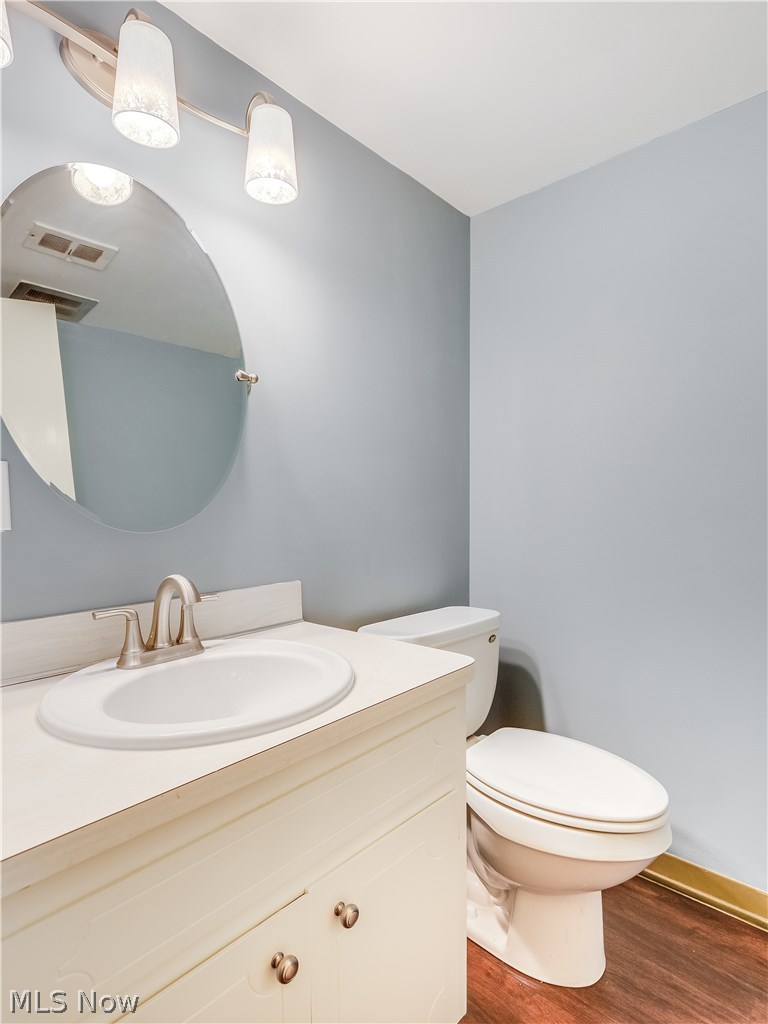1047 Roland Road Lyndhurst, OH 44124 - Photo 9 of 26 Half Bath on the first floor features new flooring, new mirror, light fixture and faucet.