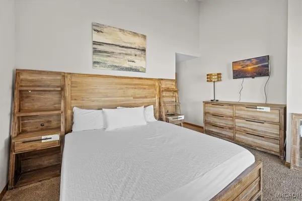 a bedroom with a bed and a closet