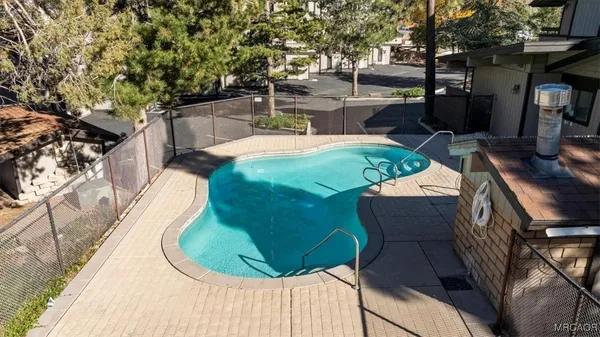 a view of a backyard with sitting area