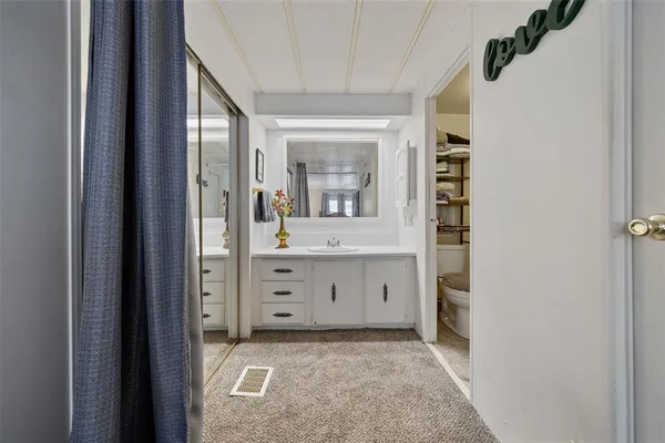 a view of a porch with furniture and a bike