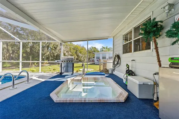 a view of a swimming pool with a lounge chairs
