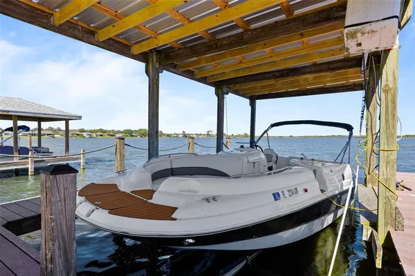 a view of a house with a yard balcony and sitting area