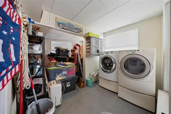 a view of a balcony with two chairs