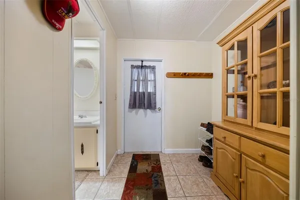 a spacious bathroom with a sink and a mirror