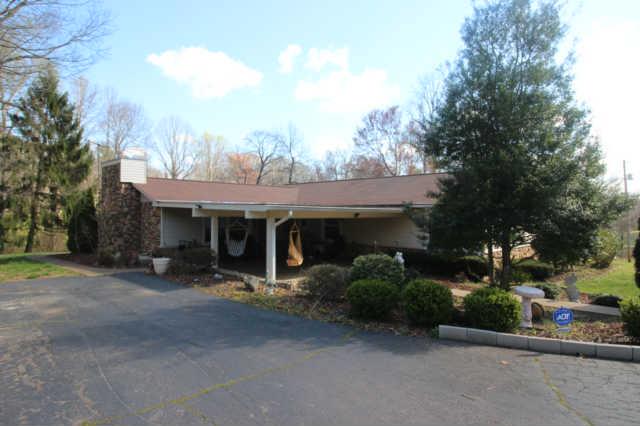 305 Black Road Dickson, TN 37055 - Photo 1 of 11 Sit outside and enjoy this huge covered patio , one level home near the interstate and town