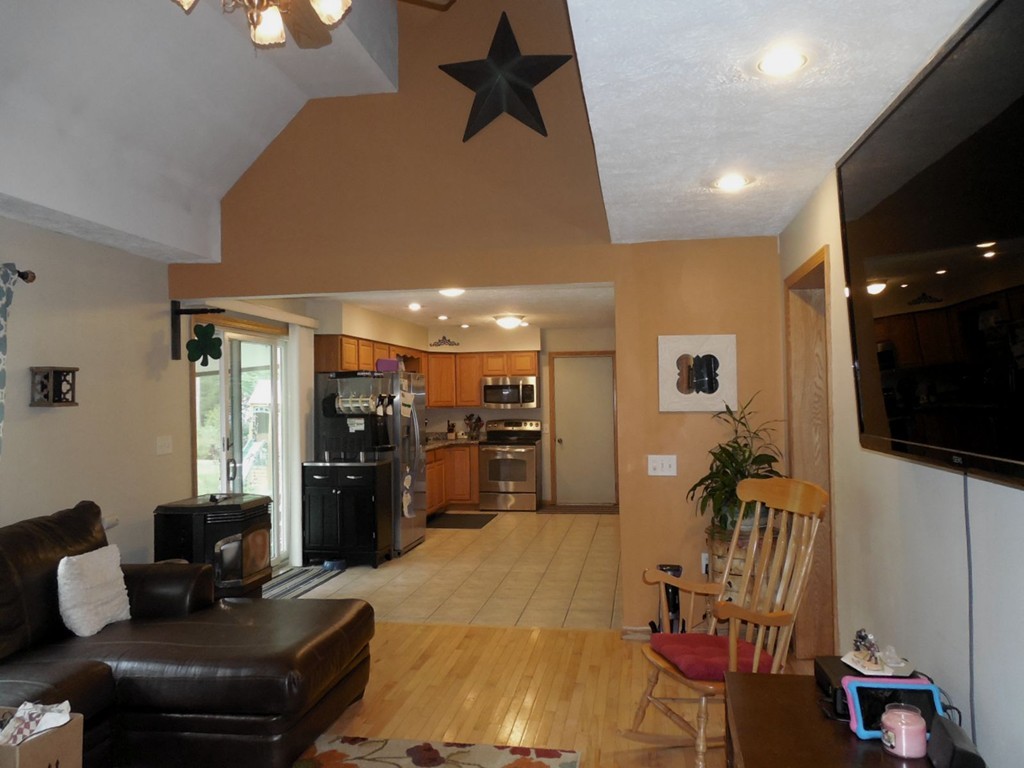 82 Osborne Road Ware, MA 01082 - Photo 10 of 29 a living room with furniture and a flat screen tv