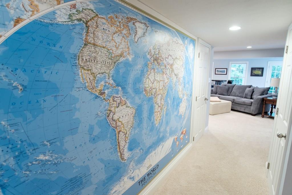 326 Buffalo Ridge Road Canonsburg, PA 15317 - Photo 21 of 25 This hallway leads from the lower level library area to the awesome lower level den. World map is a great conversation feature