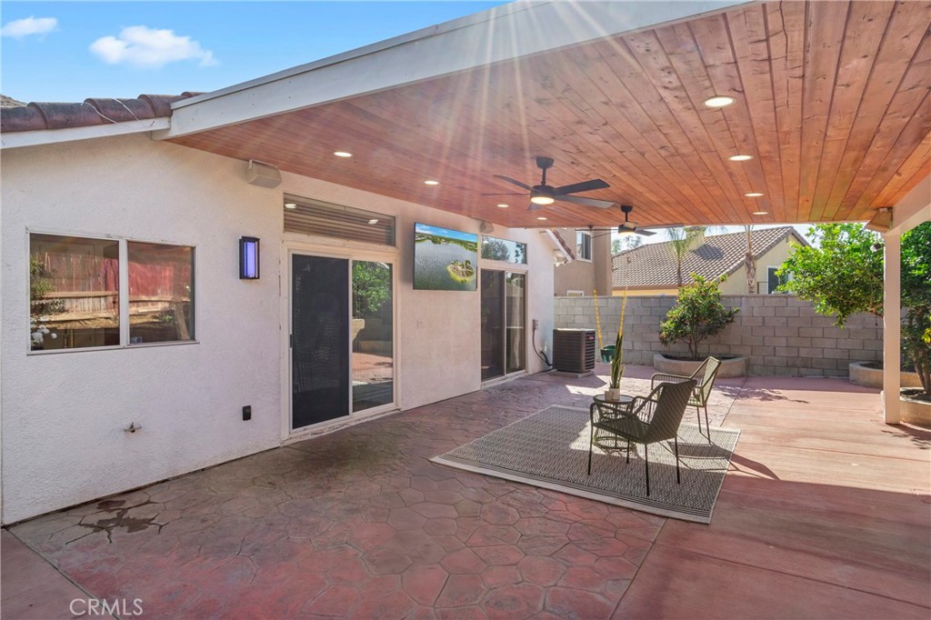 16366 West Sun Canyon Street Riverside, CA 92503 - Photo 17 of 21 a view of a patio with table and chairs and potted plants