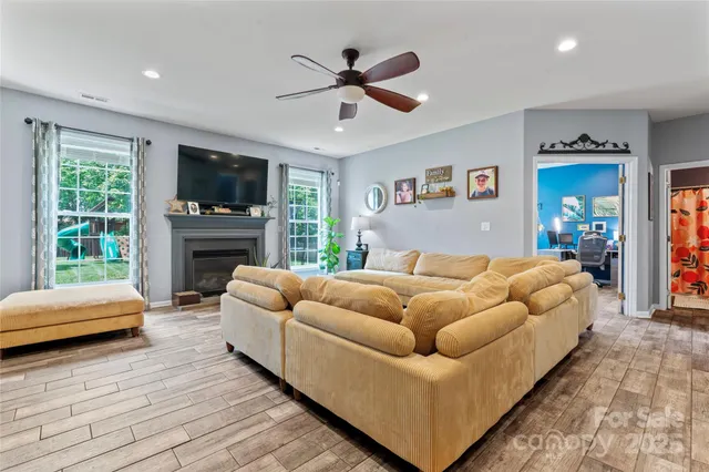 a bedroom with a bed couch and window