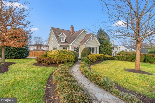 a living room with fireplace furniture and a book shelf
