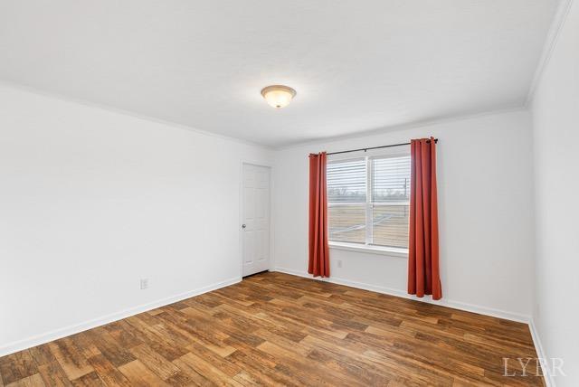 5401 Red House Road Rustburg, VA 24588 - Photo 19 of 27 a view of empty room with wooden floor and fan